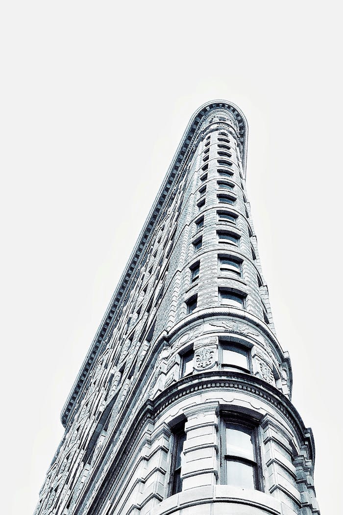 Modern architectural marvel of the Flatiron Building captured from a low angle in New York City.
